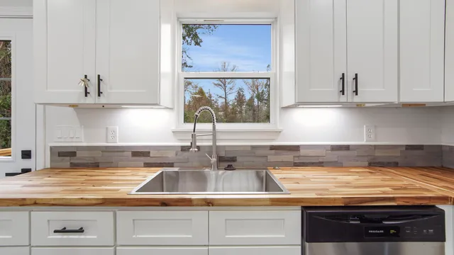 a kitchen with a stove and cabinets