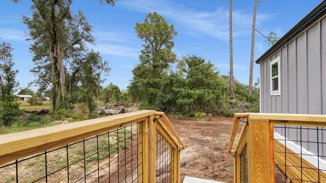 a view of balcony with two trees