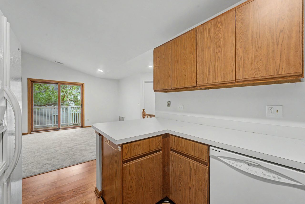 1953 North Coldspring Road Arlington Heights, IL 60004 - Photo 14 of 27 a kitchen with a sink cabinets and a window