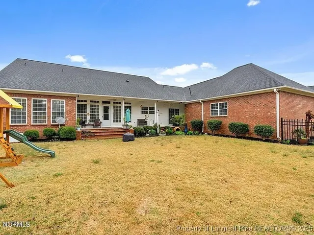 a swimming pool with outdoor seating