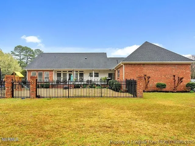 a front view of a house with swimming pool