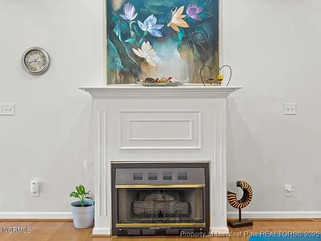 a view of a fireplace with wooden floor