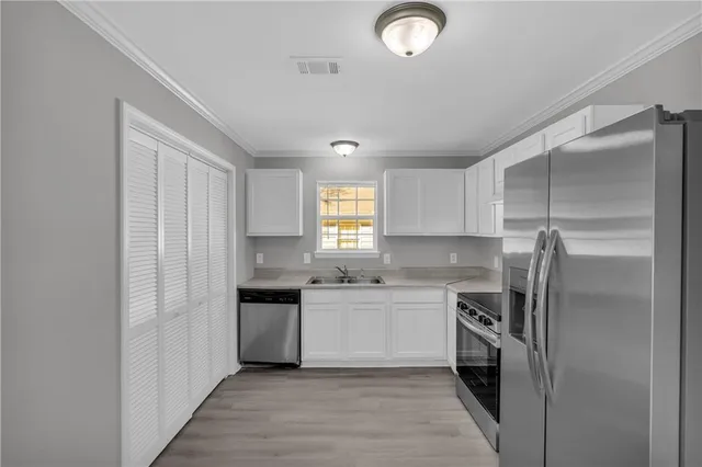 a kitchen that has a sink and a window