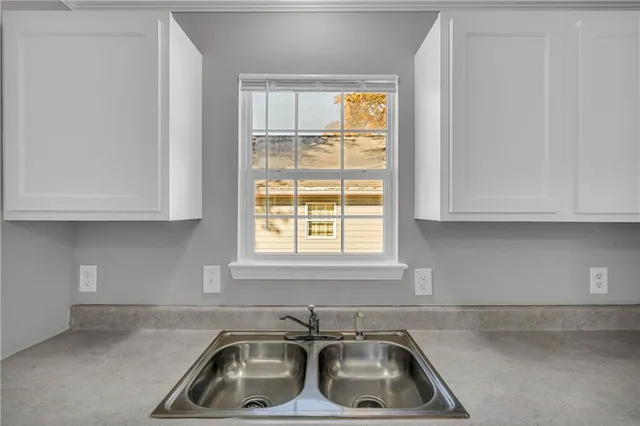 a stove top oven sitting inside of a kitchen