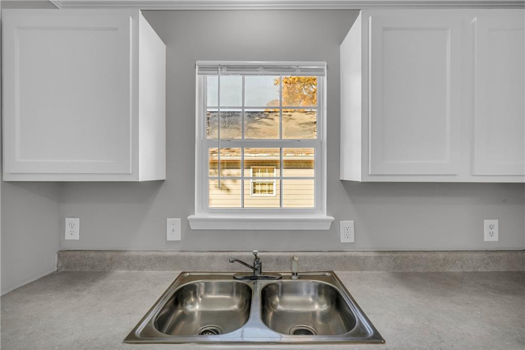 1040 Thomasville Estates Way Southeast Atlanta, GA 30315 - Photo 17 of 28 a kitchen that has a sink and a window