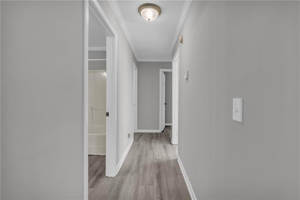 1040 Thomasville Estates Way Southeast Atlanta, GA 30315 - Photo 20 of 28 a view of a hallway with wooden floor