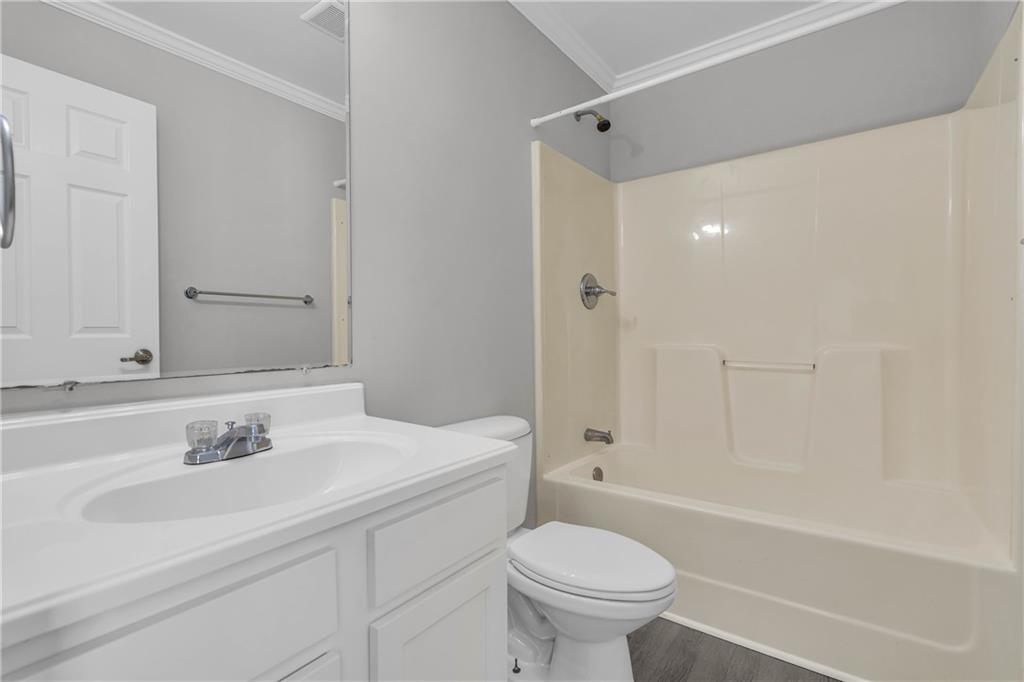 1040 Thomasville Estates Way Southeast Atlanta, GA 30315 - Photo 23 of 28 a bathroom with a sink toilet and shower