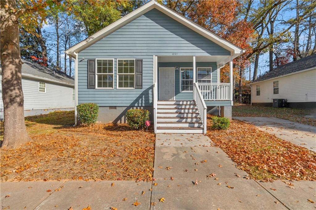 1040 Thomasville Estates Way Southeast Atlanta, GA 30315 - Photo 5 of 28 a view of a house with wooden fence