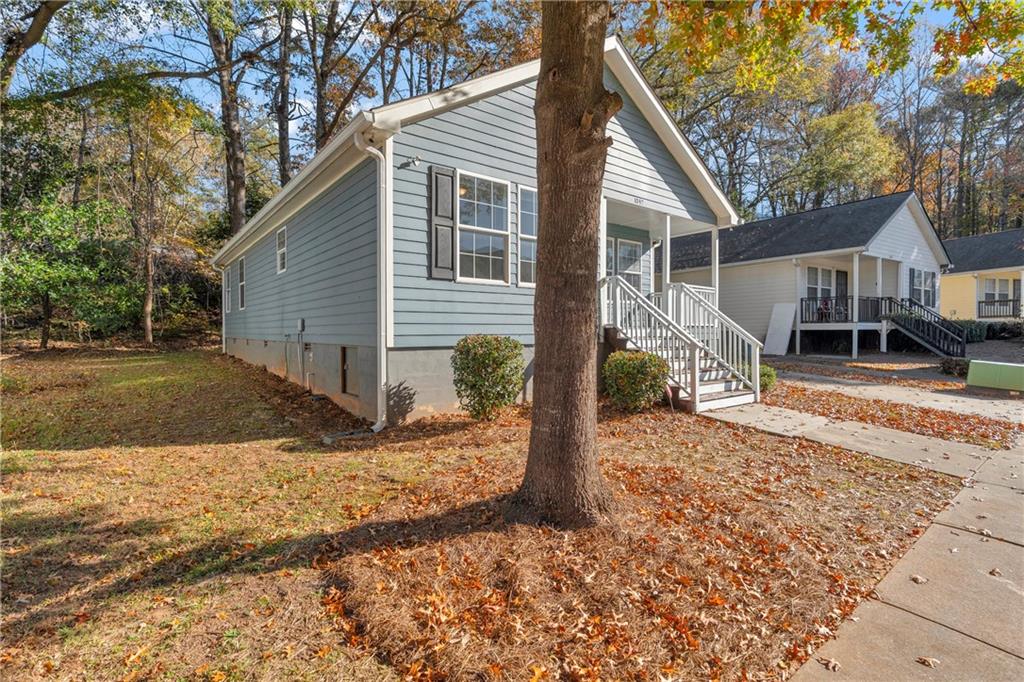 1040 Thomasville Estates Way Southeast Atlanta, GA 30315 - Photo 6 of 28 a view of a house with a yard covered in snow