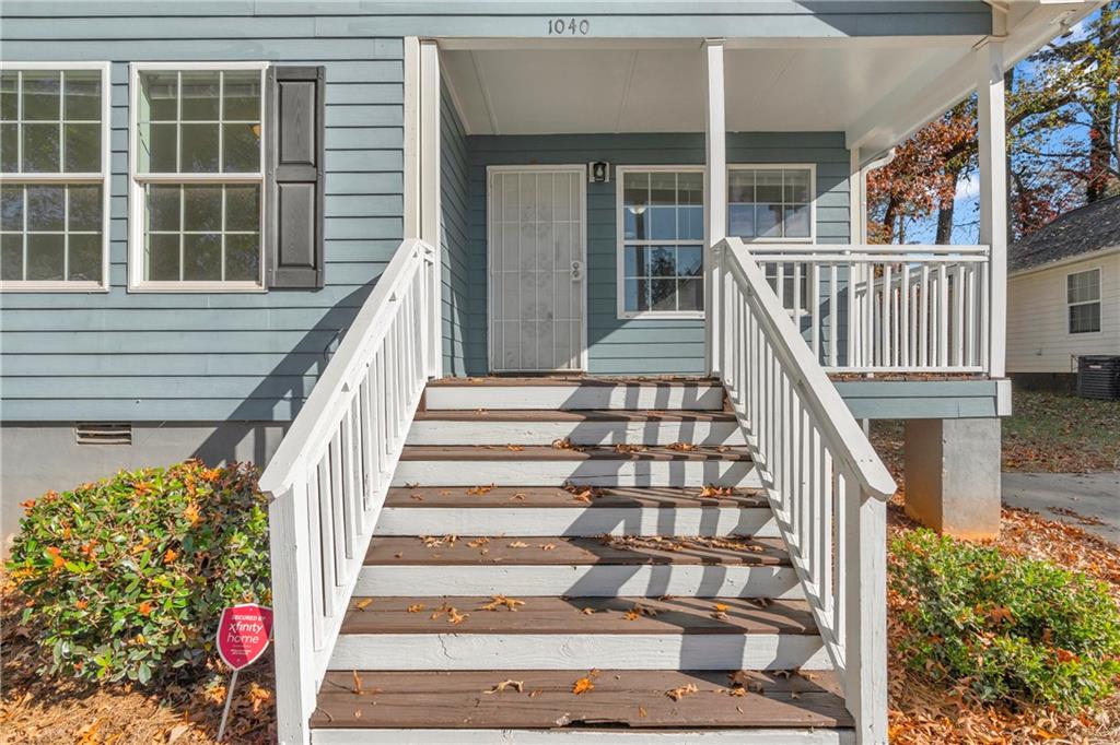 1040 Thomasville Estates Way Southeast Atlanta, GA 30315 - Photo 7 of 28 a view of staircase with white walls and windows