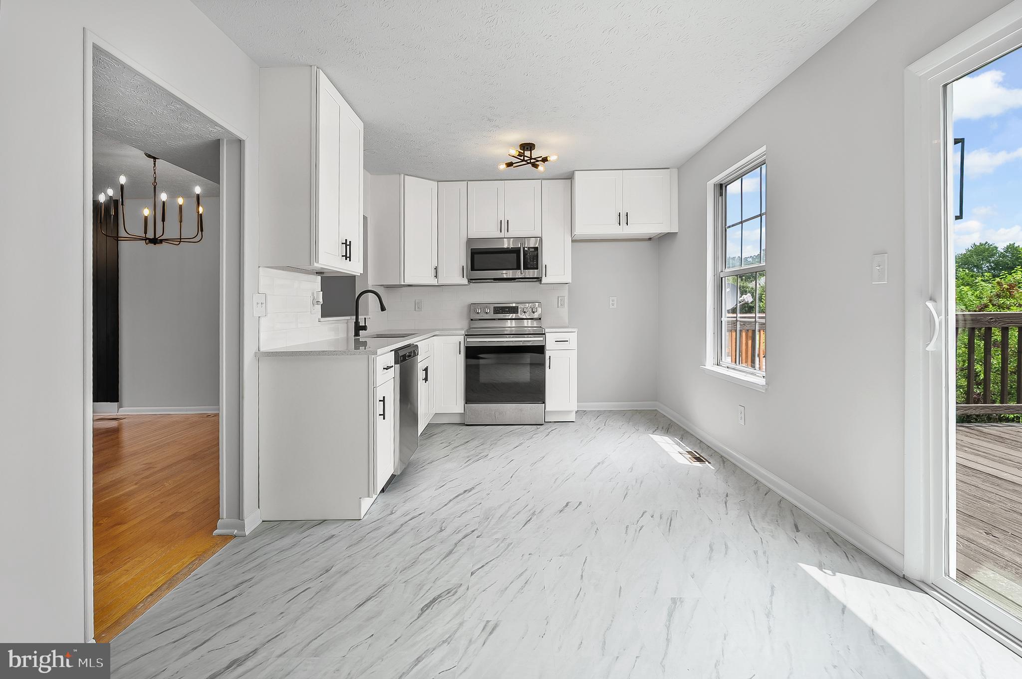 909 Olive Branch Court Edgewood, MD 21040 - Photo 12 of 36 a view of kitchen with wooden floor electronic appliances and window