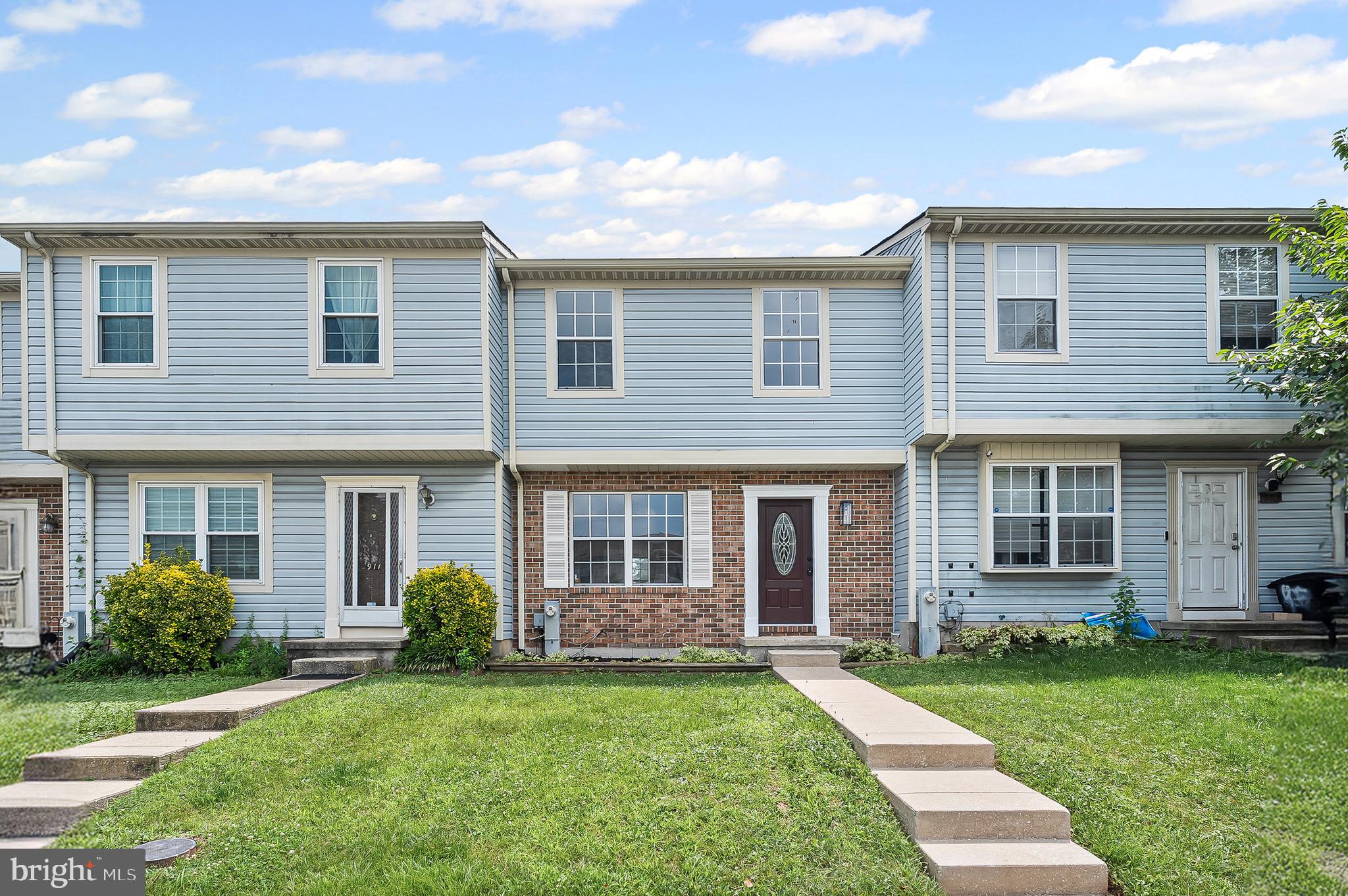 909 Olive Branch Court Edgewood, MD 21040 - Photo 30 of 36 a view of a brick house with a yard plants and a large tree