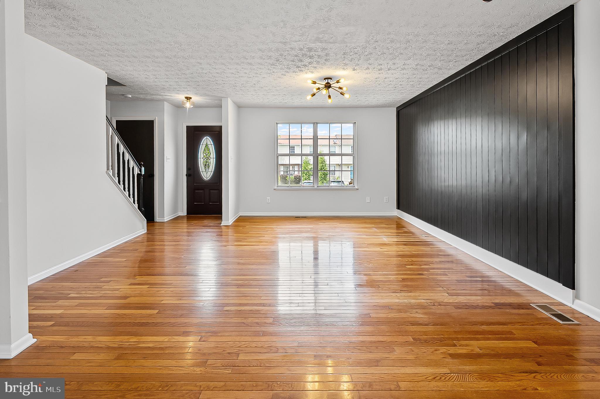 909 Olive Branch Court Edgewood, MD 21040 - Photo 8 of 36 a view of empty room with wooden floor and fan