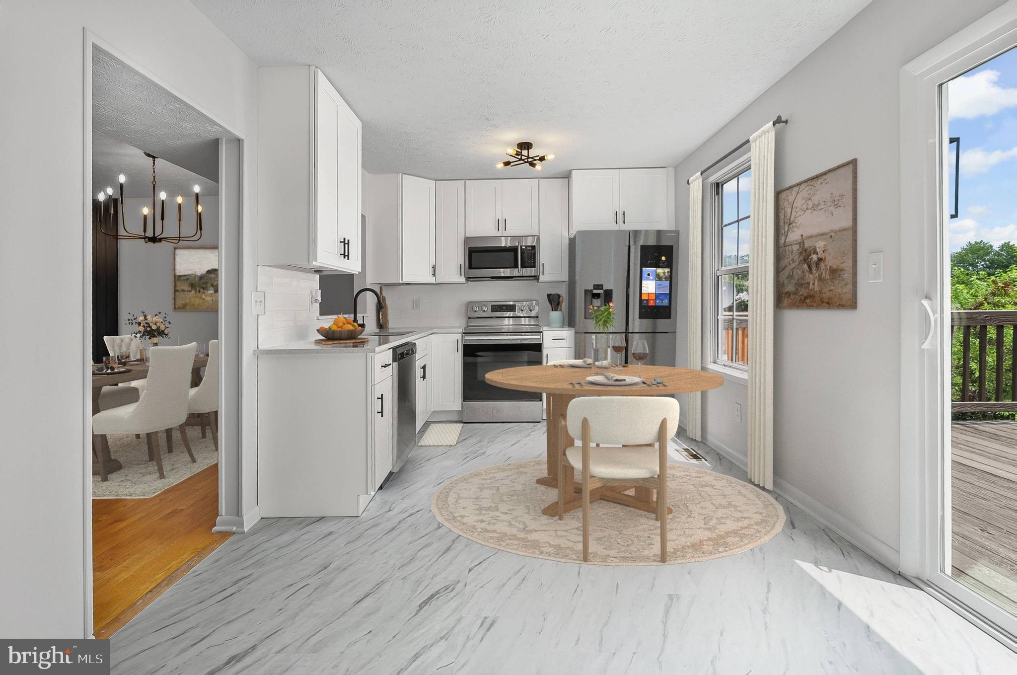 909 Olive Branch Court Edgewood, MD 21040 - Photo 10 of 36 a living room with stainless steel appliances kitchen island granite countertop furniture and a fireplace
