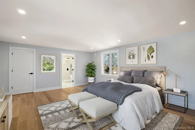 a spacious bedroom with a bed and a couch