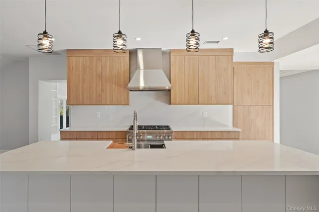 a kitchen with a sink cabinets and window
