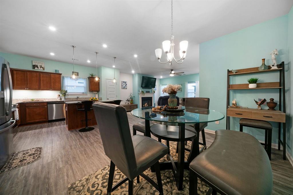17 Brooke Court Southeast Rome, GA 30161 - Photo 12 of 32 a view of a dining room with furniture and a chandelier