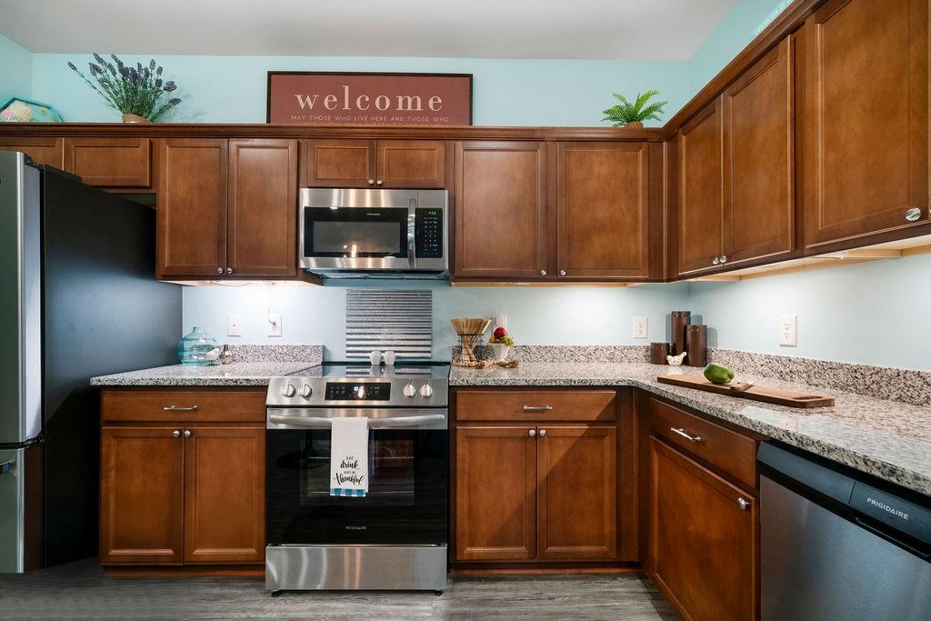 17 Brooke Court Southeast Rome, GA 30161 - Photo 15 of 32 a kitchen with stainless steel appliances granite countertop a stove a sink and a microwave
