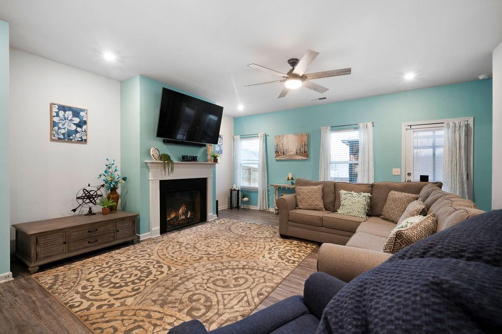 17 Brooke Court Southeast Rome, GA 30161 - Photo 18 of 32 a living room with furniture a flat screen tv and a fireplace