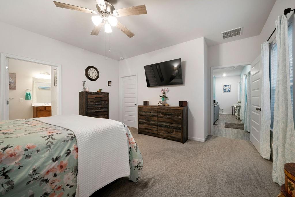 17 Brooke Court Southeast Rome, GA 30161 - Photo 23 of 32 a large bedroom with a bed and a flat screen tv