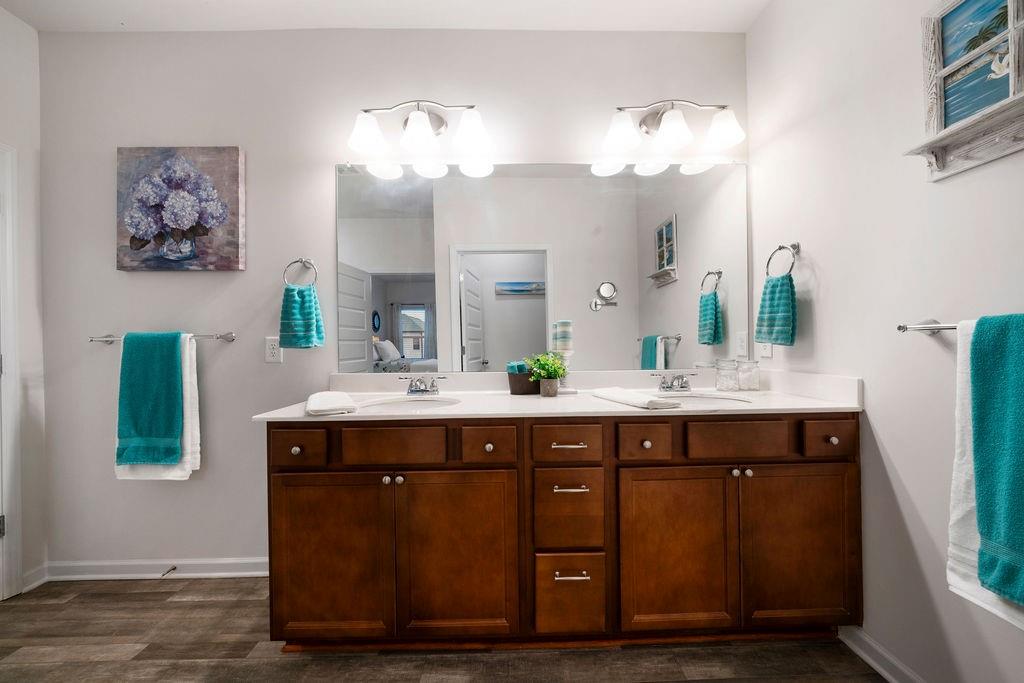 17 Brooke Court Southeast Rome, GA 30161 - Photo 24 of 32 a spacious bathroom with a double vanity sink and a mirror