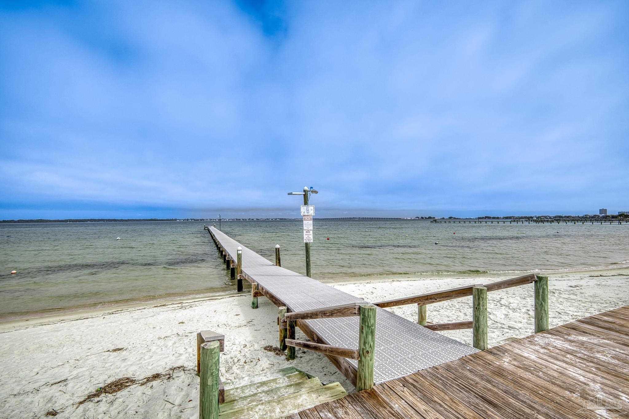 1150 Fort Pickens Road, Unit A1 Pensacola Beach, FL 32561 - Photo 1 of 45 a view of a lake with a terrace
