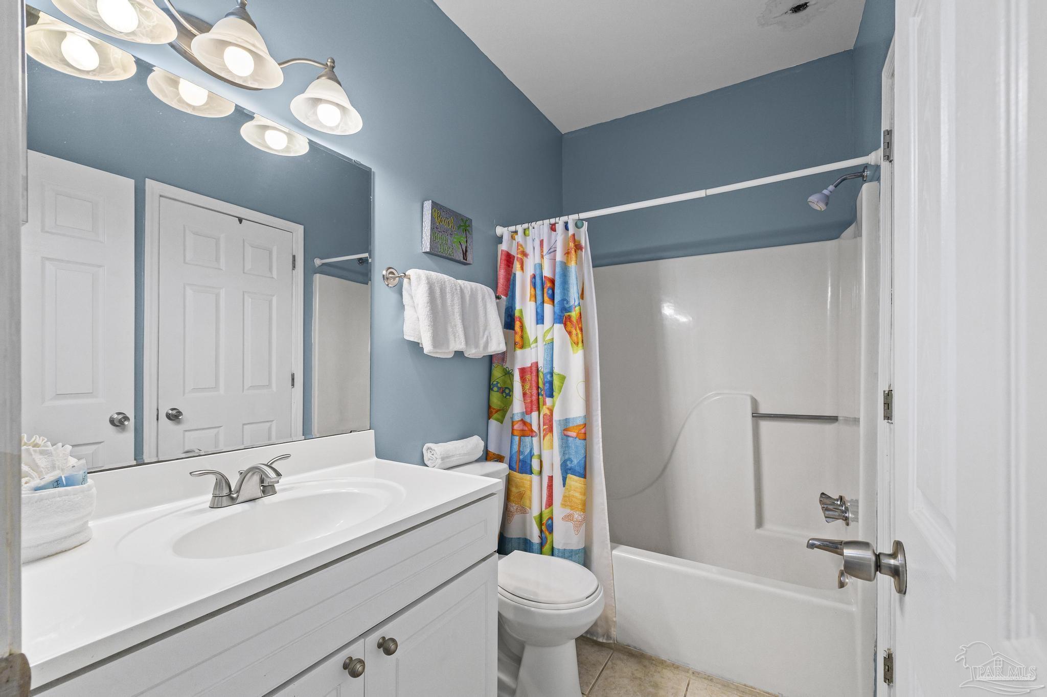1150 Fort Pickens Road, Unit A1 Pensacola Beach, FL 32561 - Photo 11 of 45 a bathroom with a sink a toilet and a shower