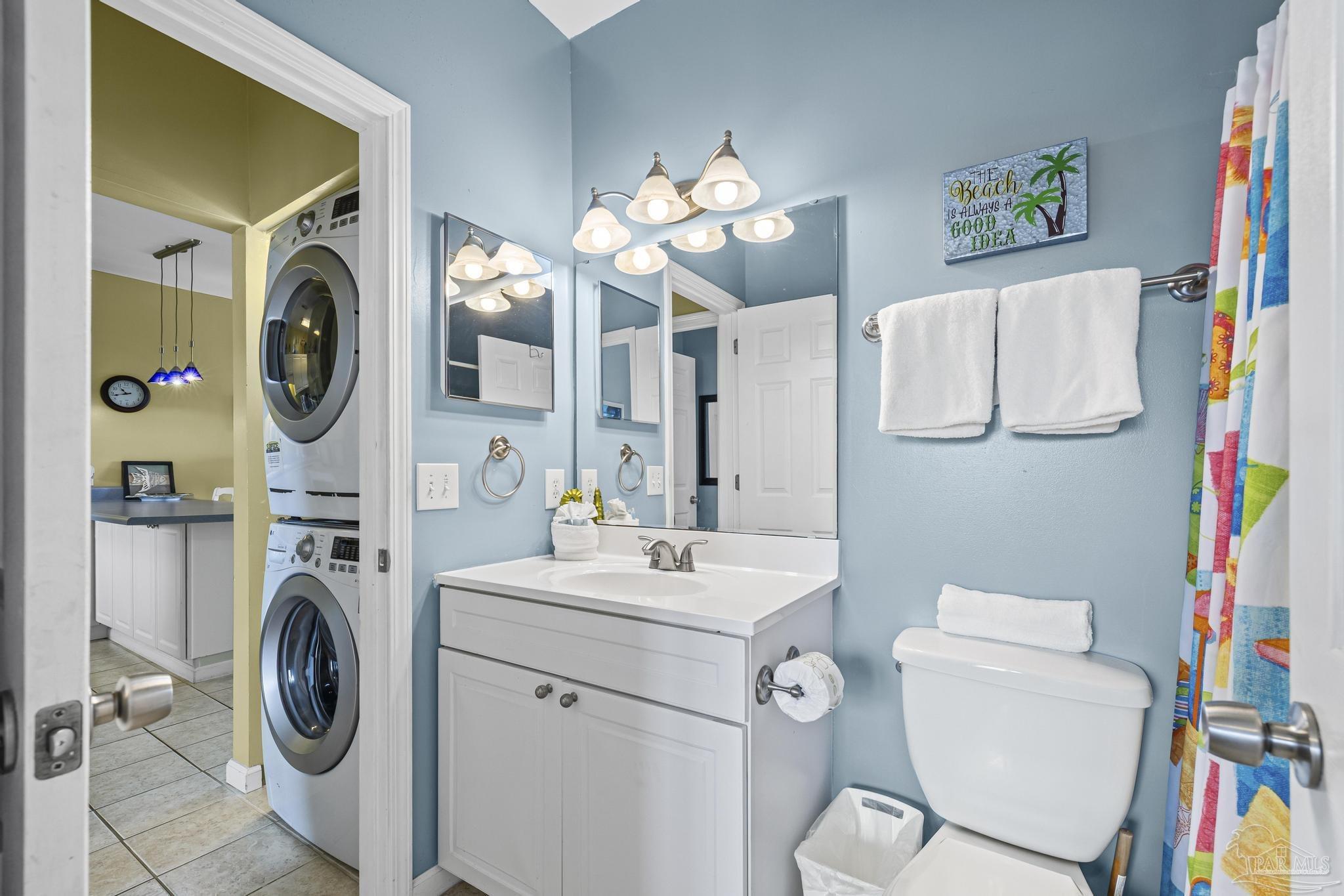 1150 Fort Pickens Road, Unit A1 Pensacola Beach, FL 32561 - Photo 14 of 45 a view of a storage and utility room with a washer and dryer