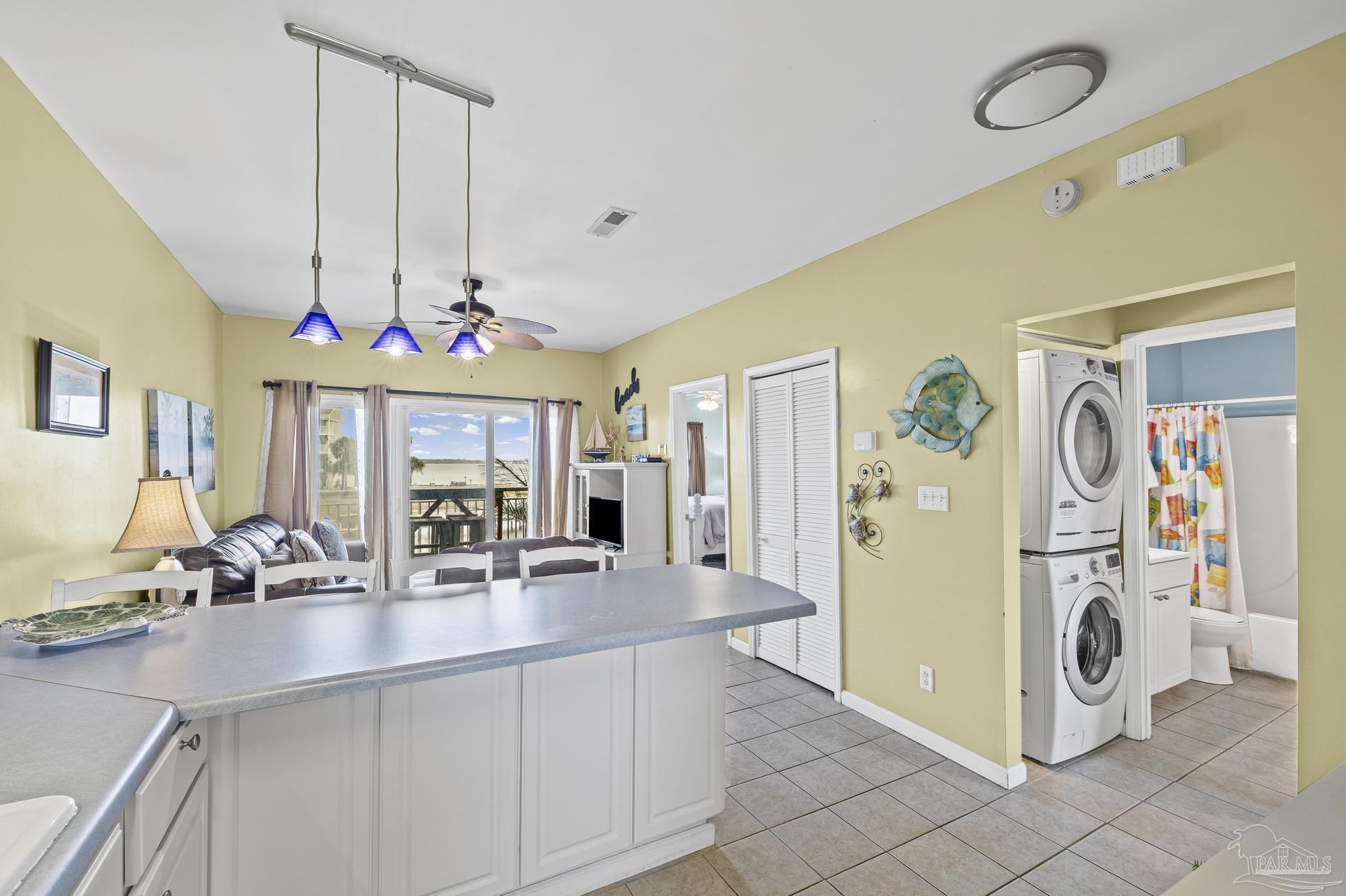 1150 Fort Pickens Road, Unit A1 Pensacola Beach, FL 32561 - Photo 21 of 45 a dining hall with a sink dishwasher and a refrigerator
