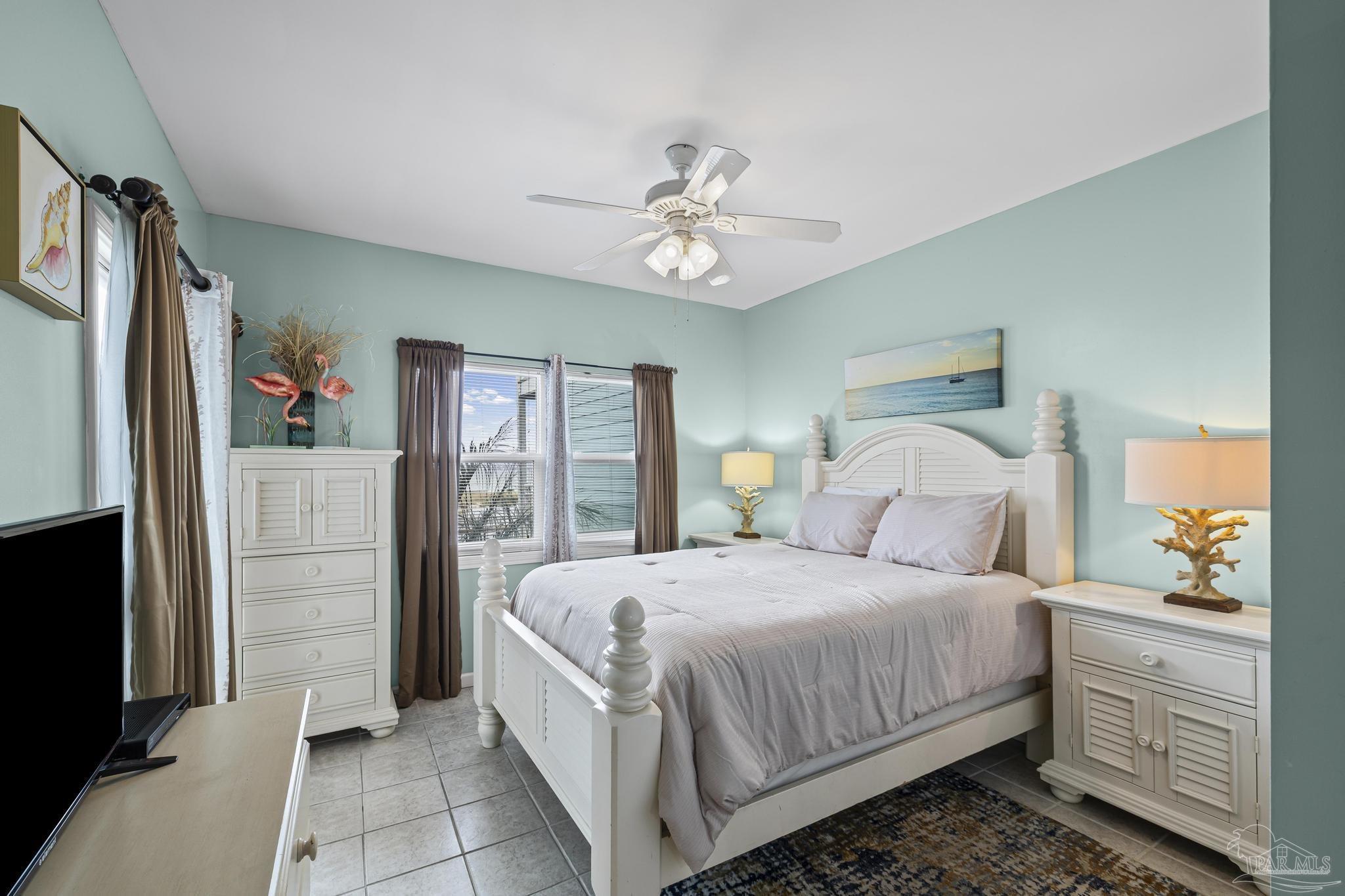 1150 Fort Pickens Road, Unit A1 Pensacola Beach, FL 32561 - Photo 26 of 45 a bedroom with a bed dresser and a window