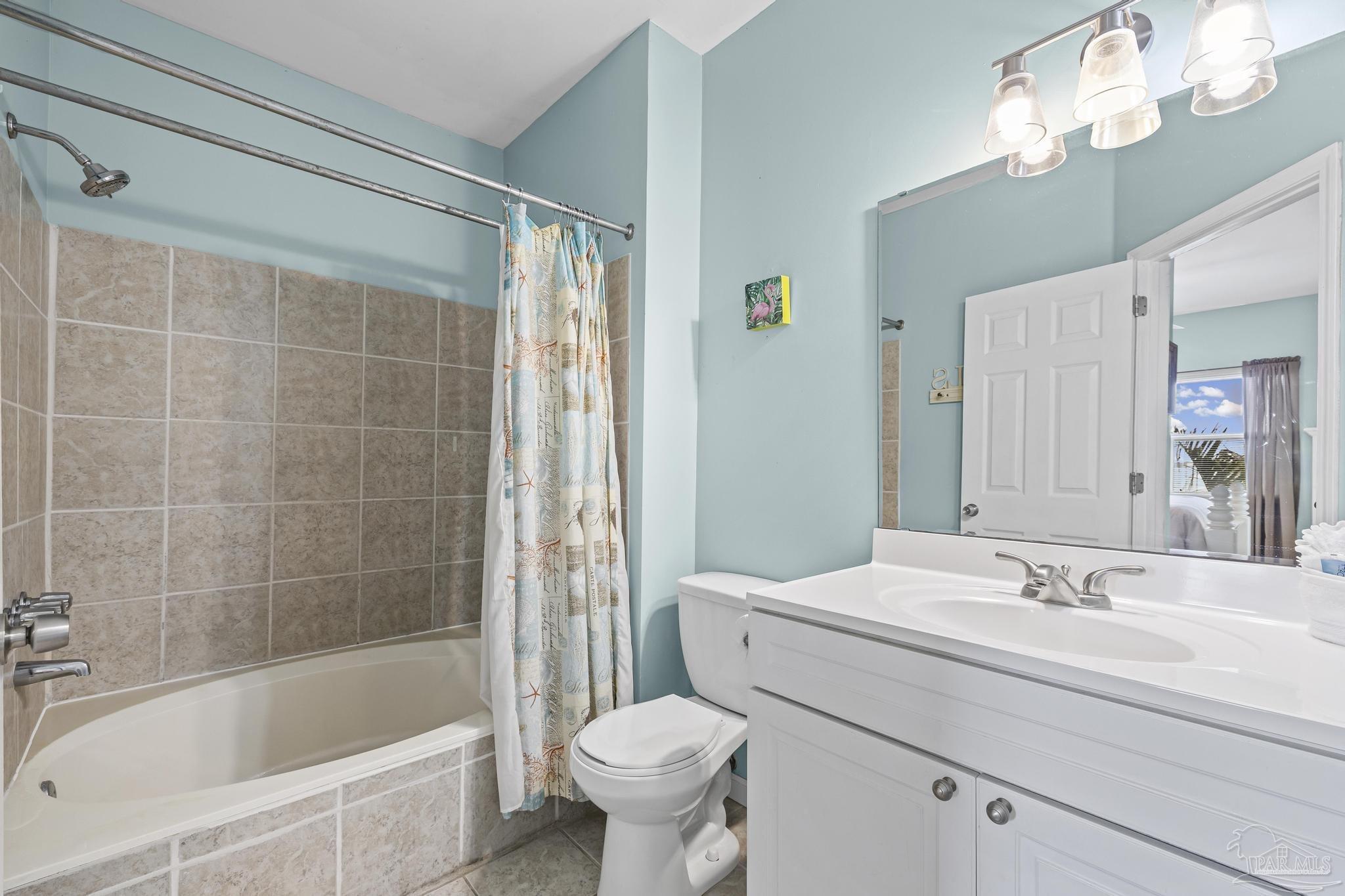 1150 Fort Pickens Road, Unit A1 Pensacola Beach, FL 32561 - Photo 28 of 45 a bathroom with a sink toilet and shower