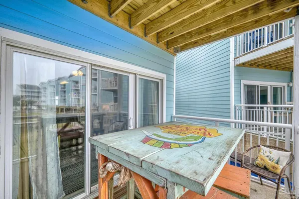 a balcony view with a seating space