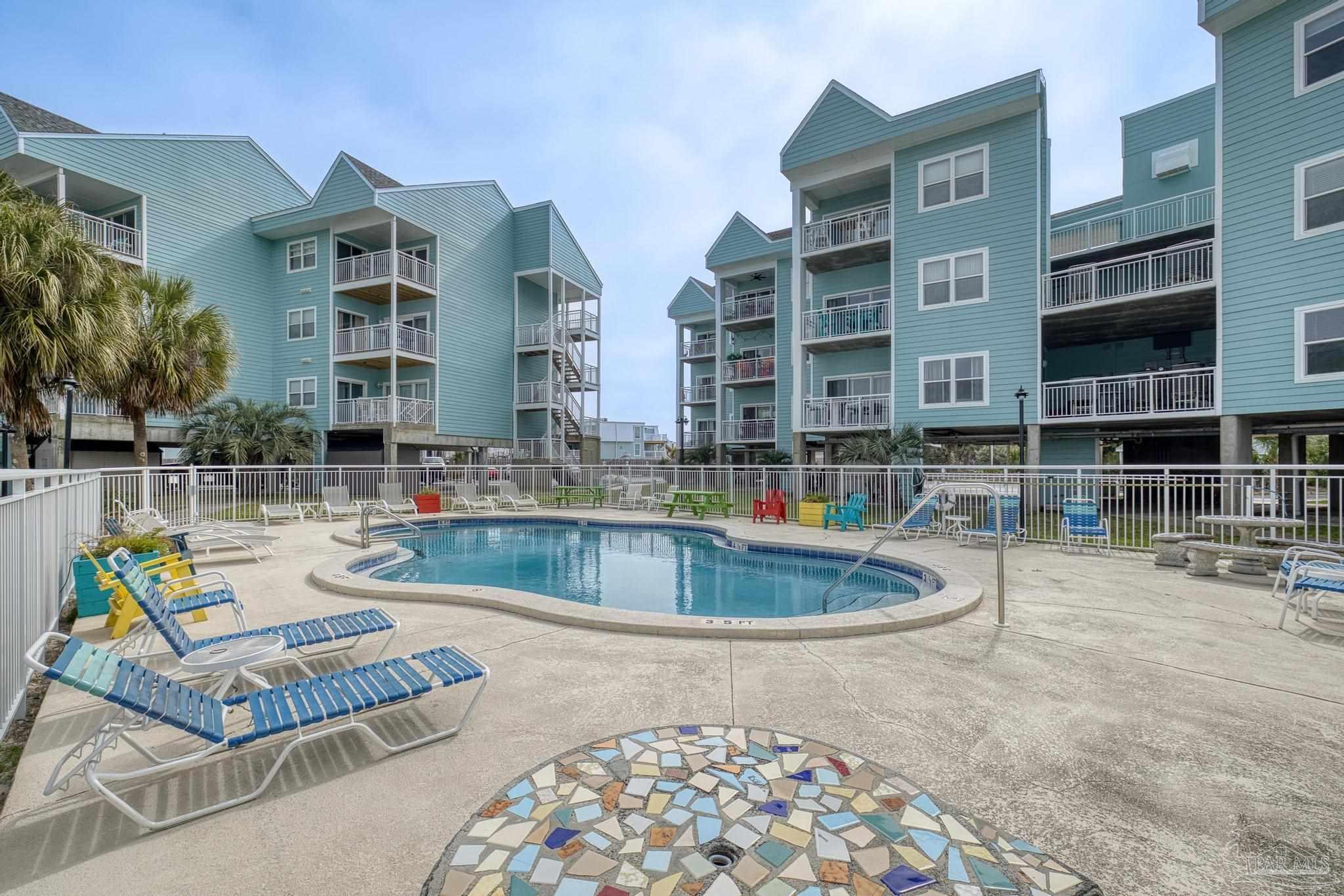 1150 Fort Pickens Road, Unit A1 Pensacola Beach, FL 32561 - Photo 3 of 45 a view of pool with outdoor seating