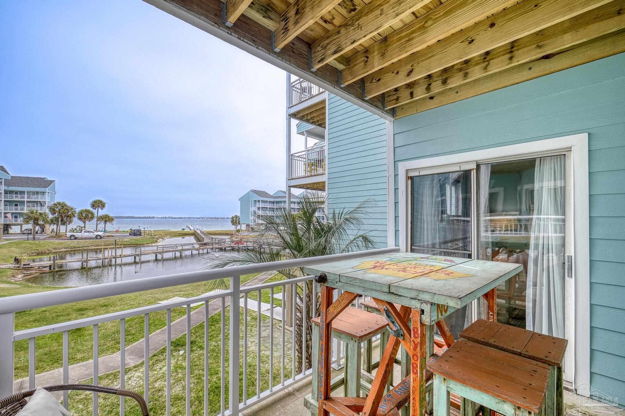 1150 Fort Pickens Road, Unit A1 Pensacola Beach, FL 32561 - Photo 31 of 45 a balcony view with a seating space