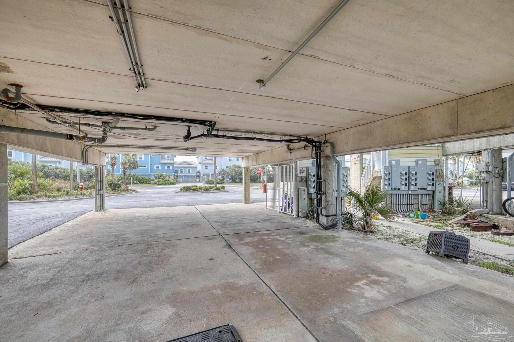 1150 Fort Pickens Road, Unit A1 Pensacola Beach, FL 32561 - Photo 35 of 45 a view of a garage with cars