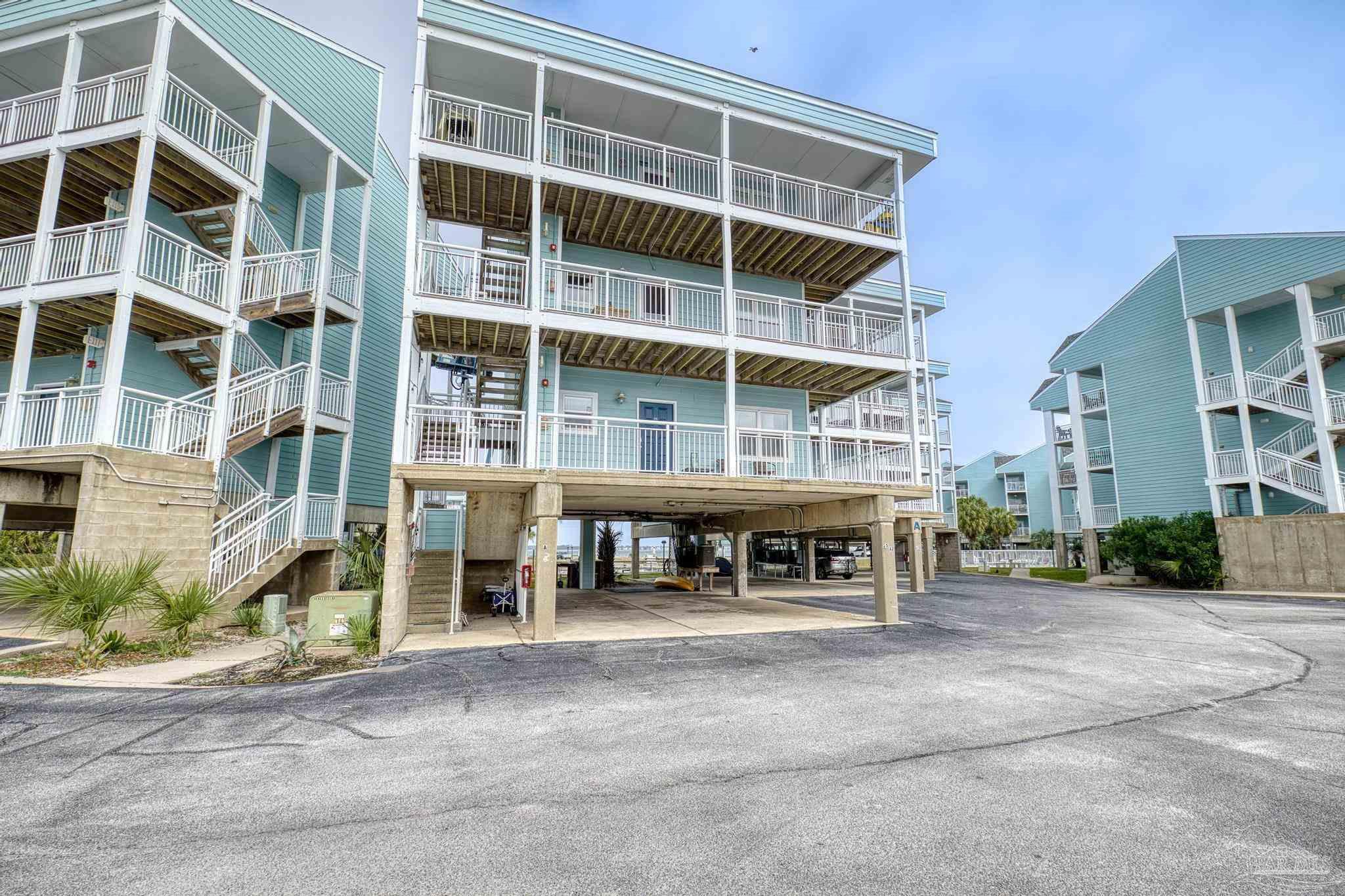 1150 Fort Pickens Road, Unit A1 Pensacola Beach, FL 32561 - Photo 6 of 45 a view of a building with a street