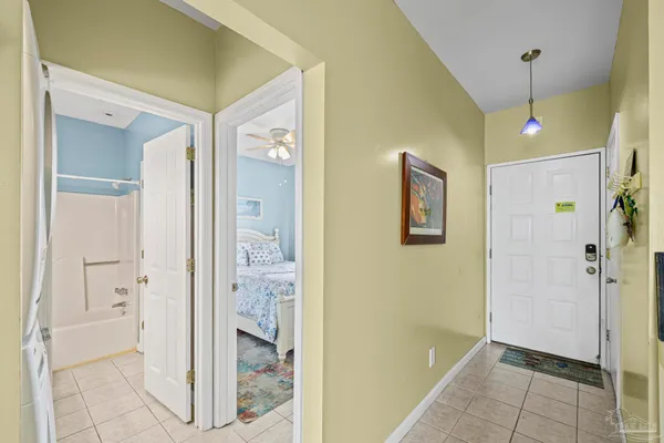 a view of a hallway with washer and dryer