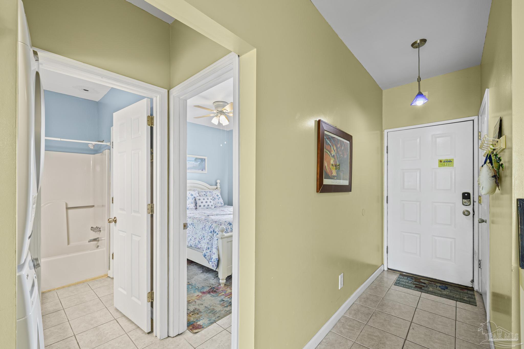 1150 Fort Pickens Road, Unit A1 Pensacola Beach, FL 32561 - Photo 9 of 45 a view of a big room with wooden floor and a bathroom