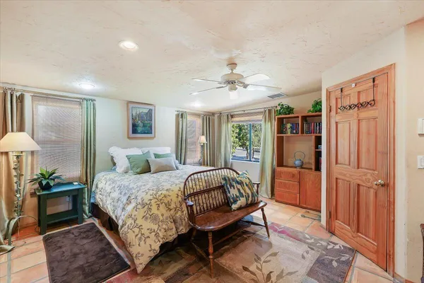 a bed room with a bed and a chandelier