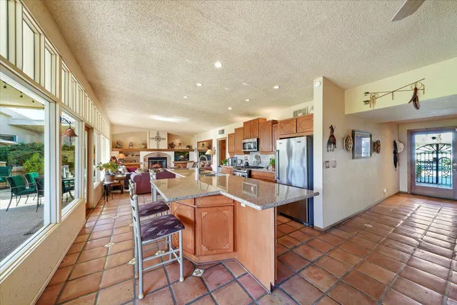 a living room with lots of furniture and a view of living room