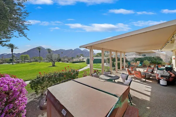 a view of an outdoor sitting area with furniture