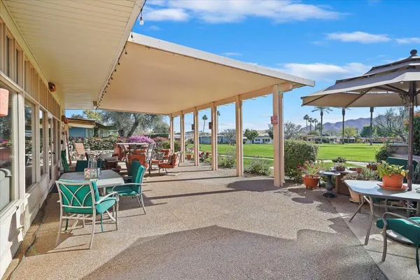 a view of a porch with sitting area