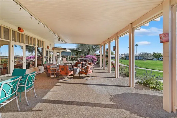 a outdoor space with patio the couches and a dining table with chairs