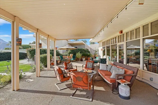 a view of a house with garden and porch
