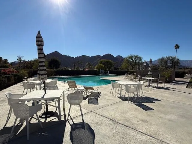 a view of a swimming pool with a patio