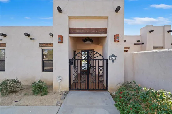 a view of entryway with a flower garden