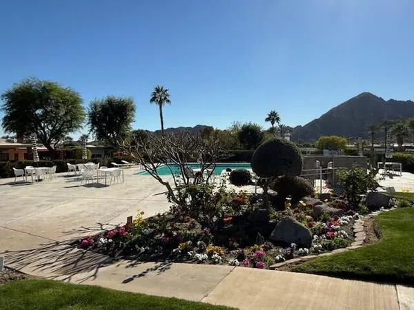 a view of a balcony with a table and chairs