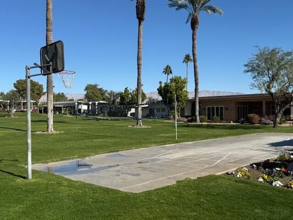 a view of a park with houses