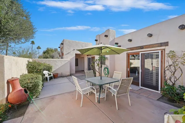 a table and chairs in a patio