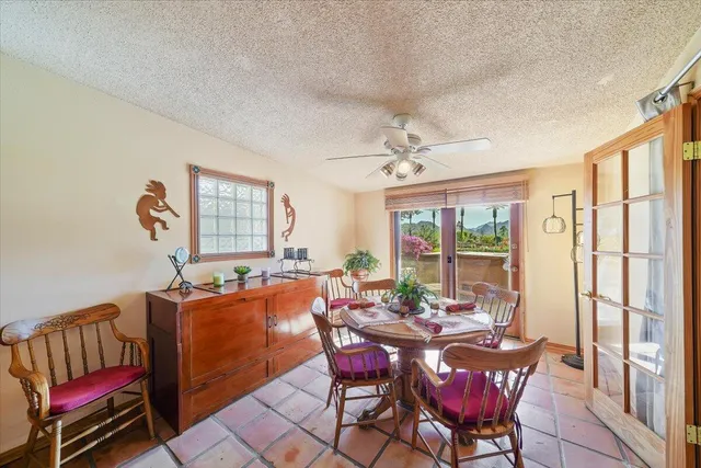 a view of a dining room with furniture window and outside view